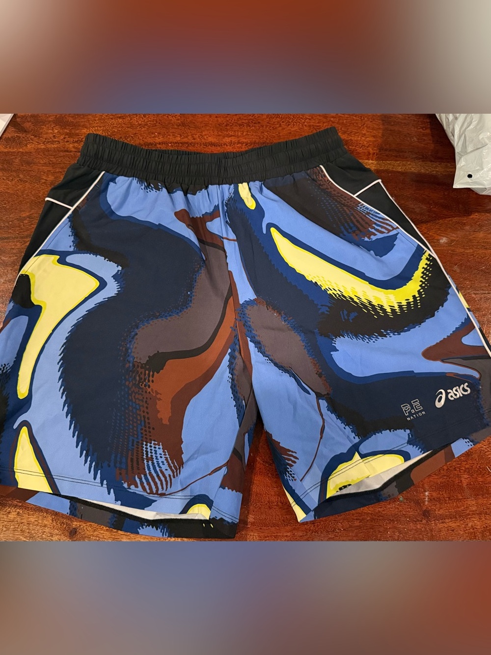 P.E Nation Blue Abstract Print Swim Trunks with Yellow Accents